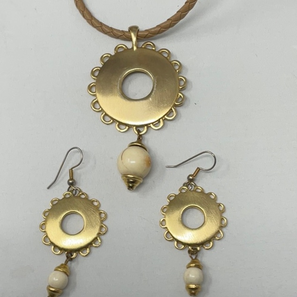 Gold and glass bead necklace on a braided leather cord, and matching earrings